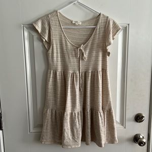 Rayon, polyester, spandex lightweight dress in beige. Size medium.
